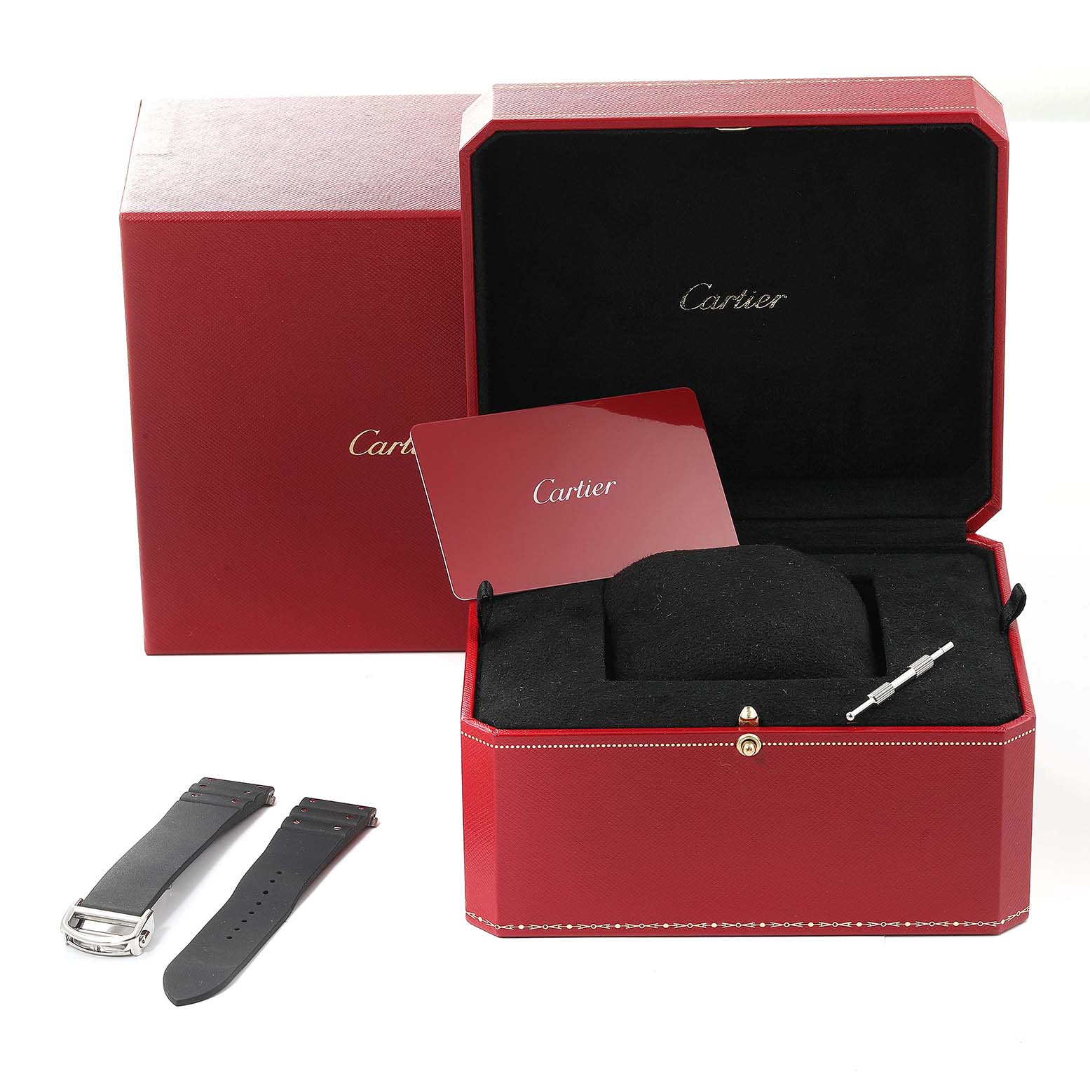 The image shows the Cartier Santos WSSA0037 Men's Stainless Steel Grey Dial WSSA0037 Men's Stainless Steel Grey Dial watch packaging, including an extra strap, a tool, and documentation, viewed from the front.