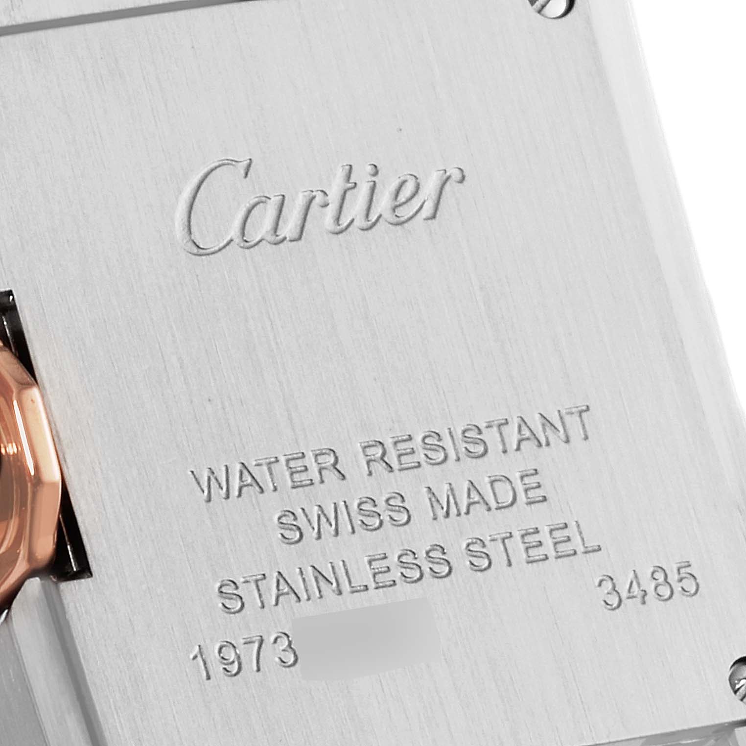 The image shows the back case of the Cartier Tank Anglaise W5310019 Women's Steel and Gold (two tone) Silver Dial W5310019 Women's Steel and Gold (two tone) Silver Dial watch, displaying the brand name, water resistance, and other details.