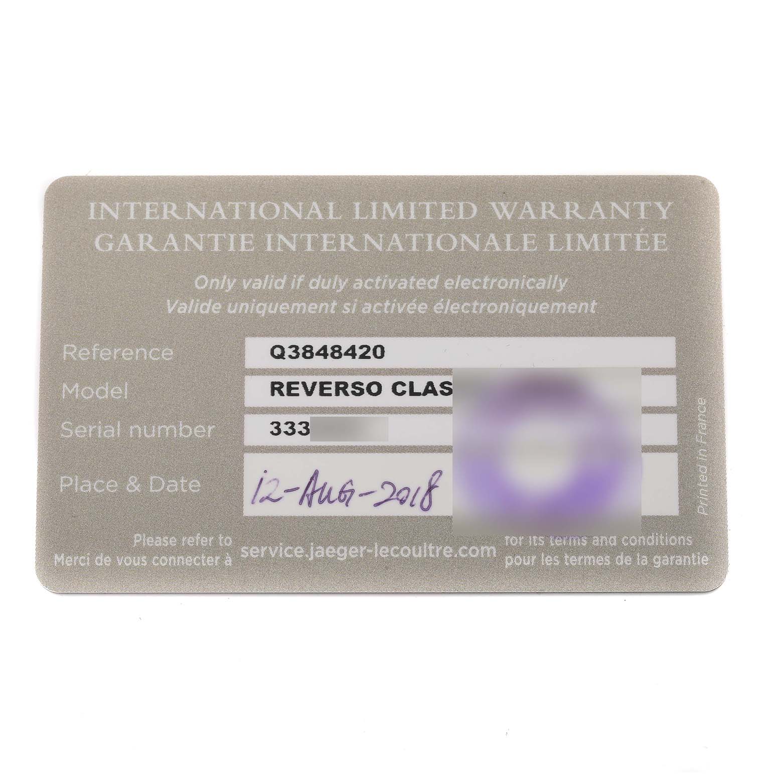 The image shows the warranty card for the Jaeger-LeCoultre Reverso watch model.