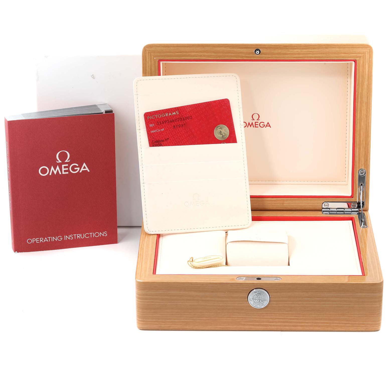 The image shows the outer box, operating instructions, and warranty card for the Omega Planet Ocean 215.92.46.22.01.002 Men's Ceramic Black Dial 215.92.46.22.01.002 Men's Ceramic Black Dial watch arranged on a flat surface.