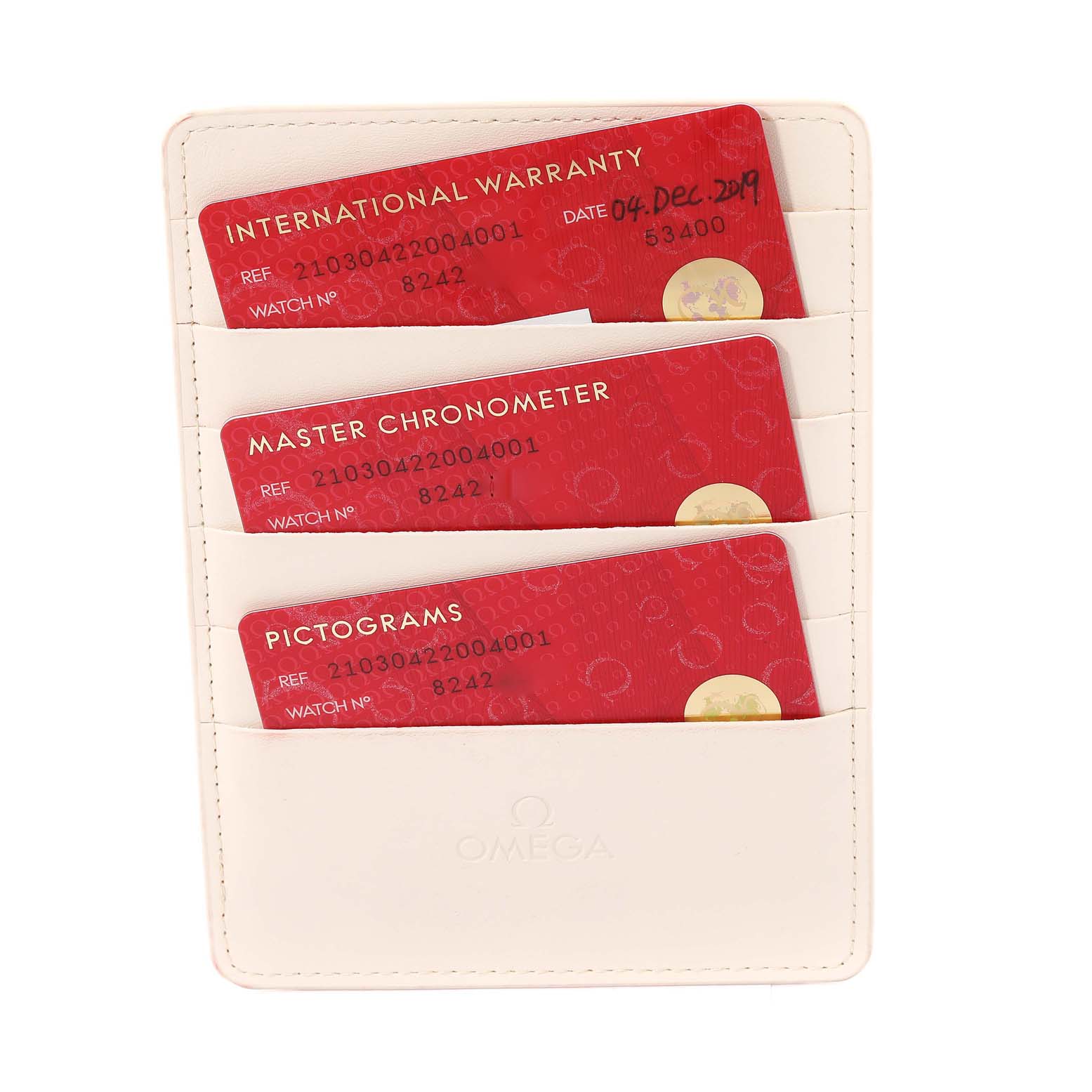 The image shows Omega Seamaster 210.30.42.20.04.001 Men
s Stainless Steel White Dial 210.30.42.20.04.001 Men
s Stainless Steel White Dial model warranty cards and a cream cardholder from a top-down angle.