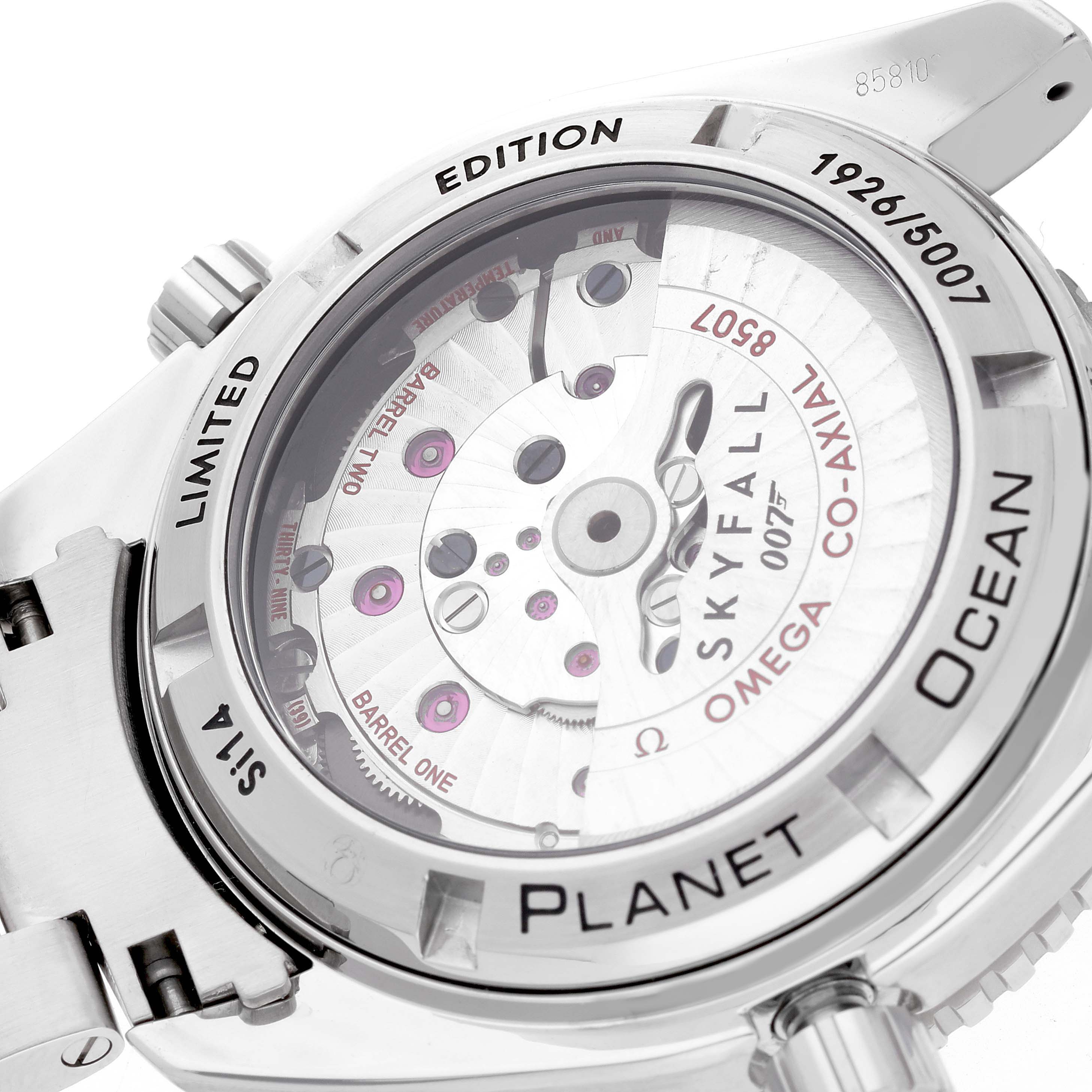 The image shows the back of an Omega Planet Ocean 232.30.42.21.01.004 Men
s Stainless Steel Black Dial 232.30.42.21.01.004 Men
s Stainless Steel Black Dial watch, highlighting its internal mechanism and "Skyfall" limited edition engraving.