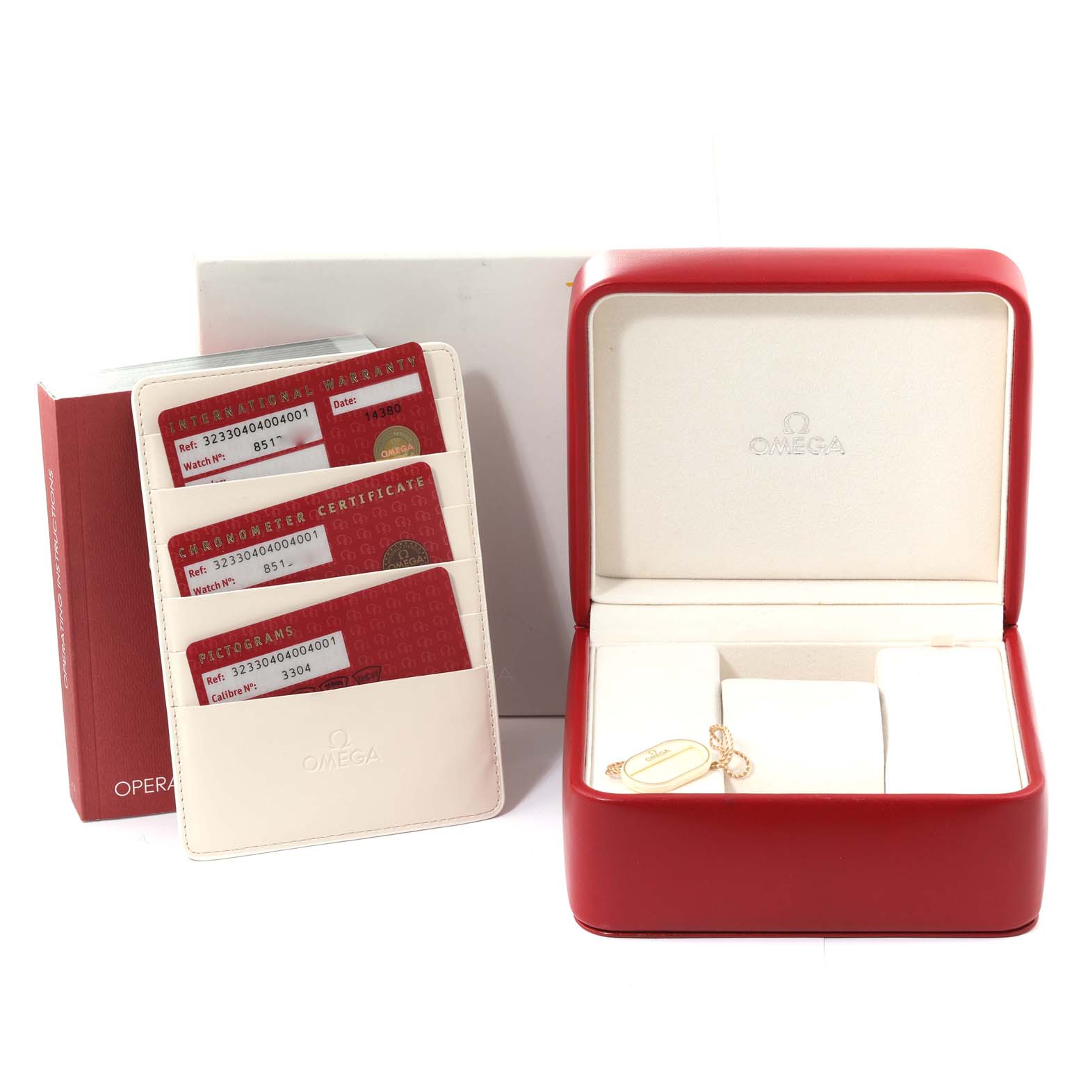 This image shows the packaging, warranty cards, and box for an Omega Speedmaster 323.30.40.40.04.001 Men's Stainless Steel White Dial 323.30.40.40.04.001 Men's Stainless Steel White Dial watch.