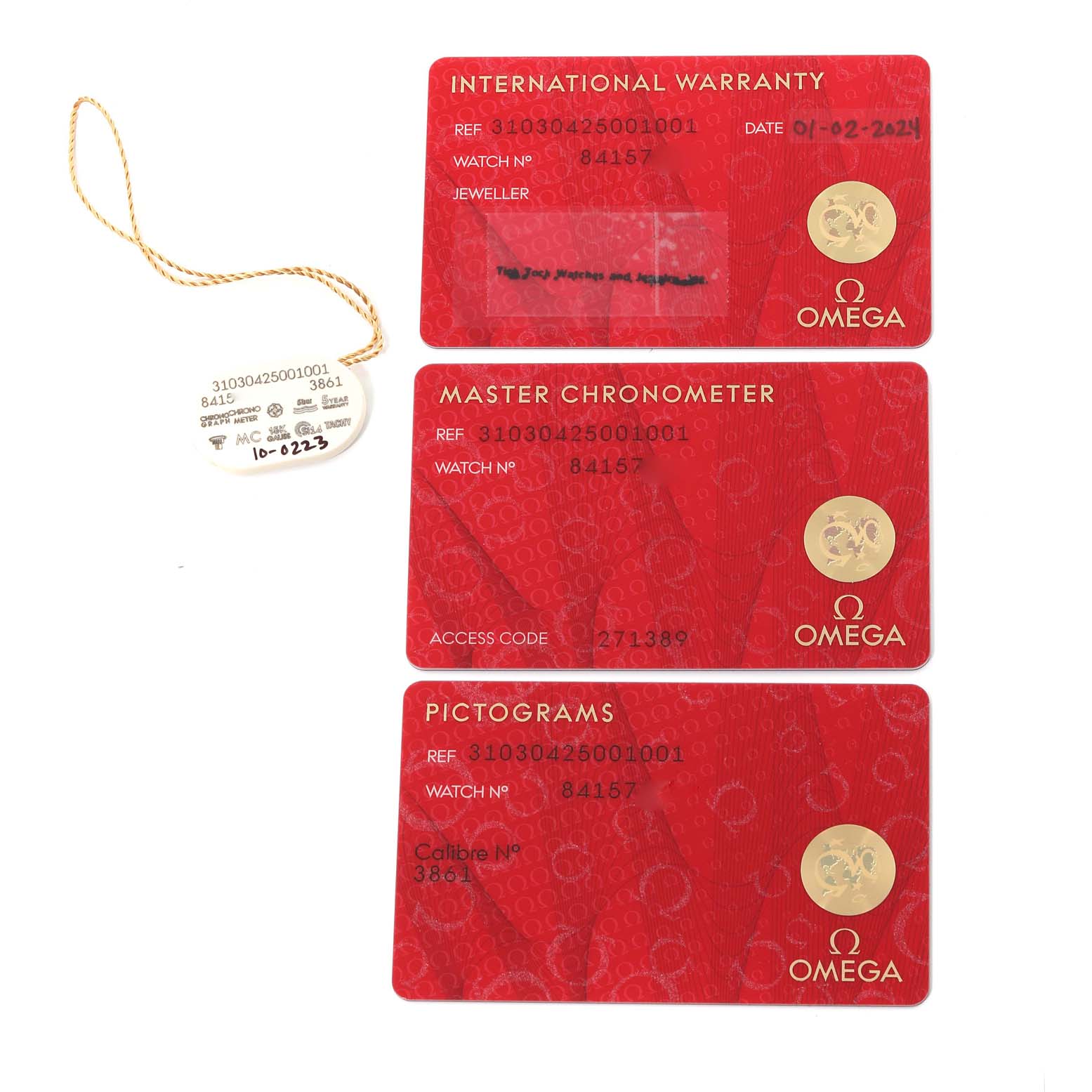 The image shows the warranty and identification cards for an Omega Speedmaster 310.30.42.50.01.001 Men
s Stainless Steel Black Dial 310.30.42.50.01.001 Men
s Stainless Steel Black Dial watch.