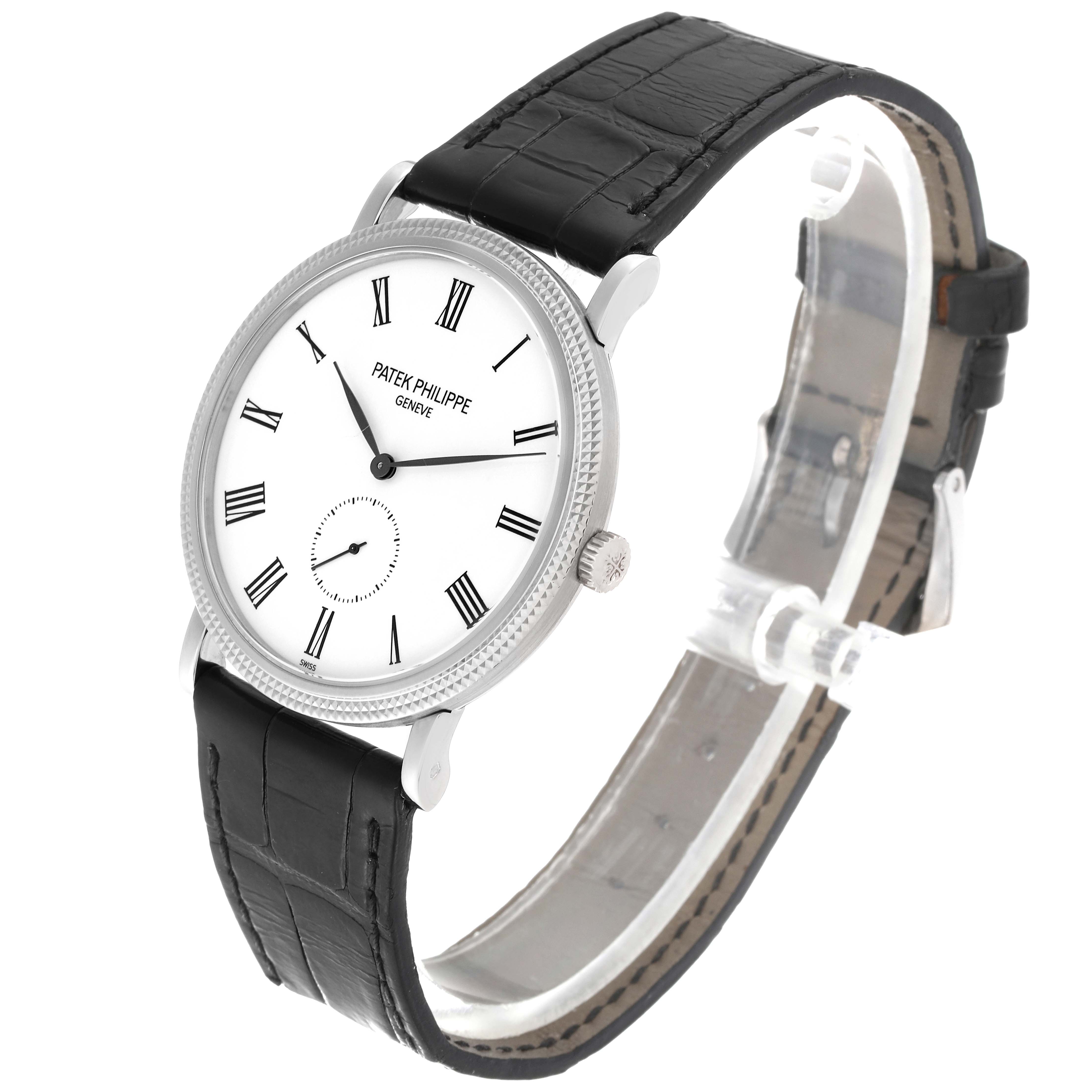 This image shows a Patek Philippe Calatrava 5119G-001 Men
s White Gold White Dial 5119G-001 Men
s White Gold White Dial watch from a three-quarter angle, highlighting the watch face, strap, and crown.