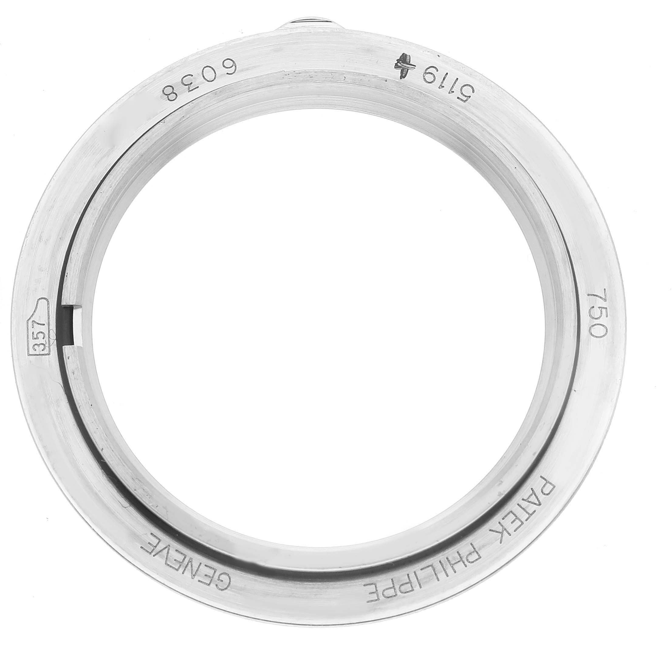 This image shows the stainless steel case back of a Patek Philippe Calatrava 5119G-001 Men
s White Gold White Dial 5119G-001 Men
s White Gold White Dial watch taken from a top-down angle.