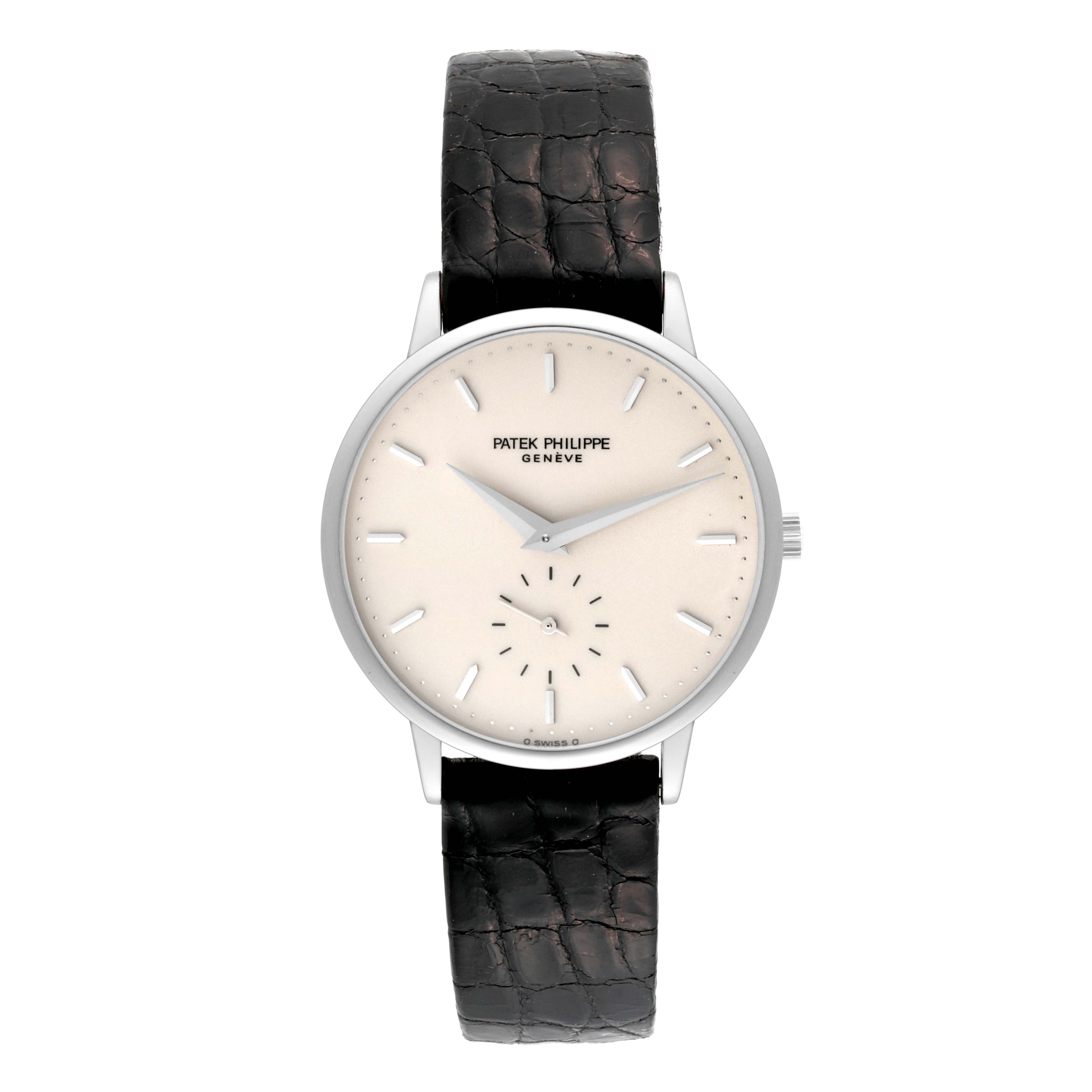 The image shows a front view of a Patek Philippe Calatrava 3893G Men
s White Gold White Dial 3893G Men
s White Gold White Dial watch, displaying its dial, hands, and black leather strap.