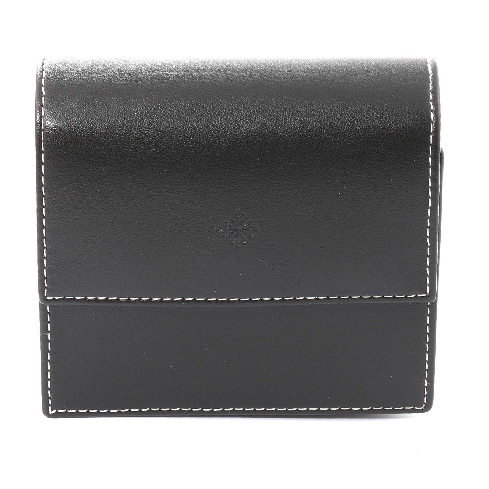 This image shows a black leather pouch with white stitching, likely a protective case for the Patek Philippe Calatrava 3893G Men
s White Gold White Dial 3893G Men
s White Gold White Dial watch.