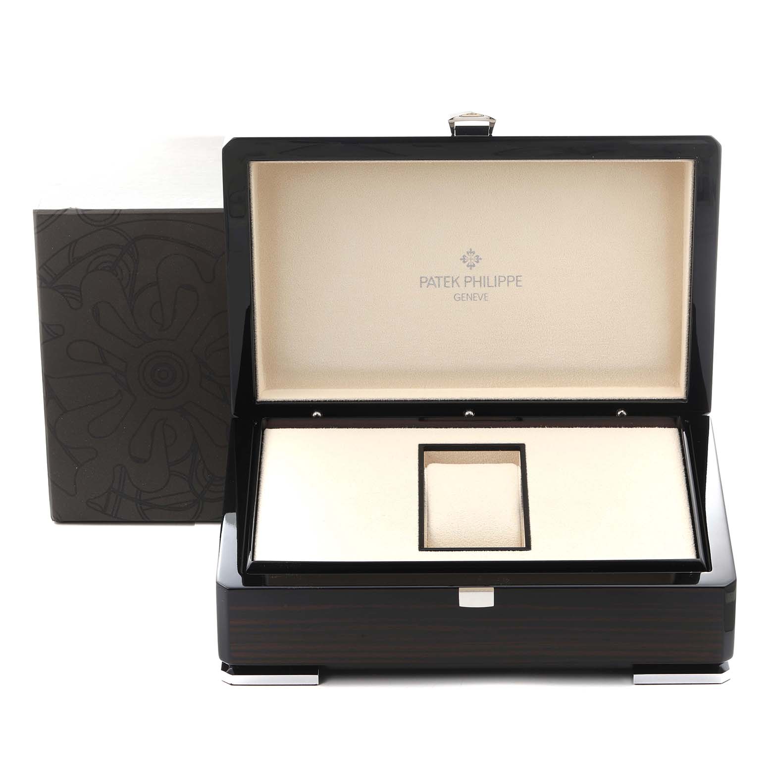 The image shows an open box for a Patek Philippe Complications 5038G Men
s White Gold Black Dial 5038G Men
s White Gold Black Dial watch, displaying the interior with branding.