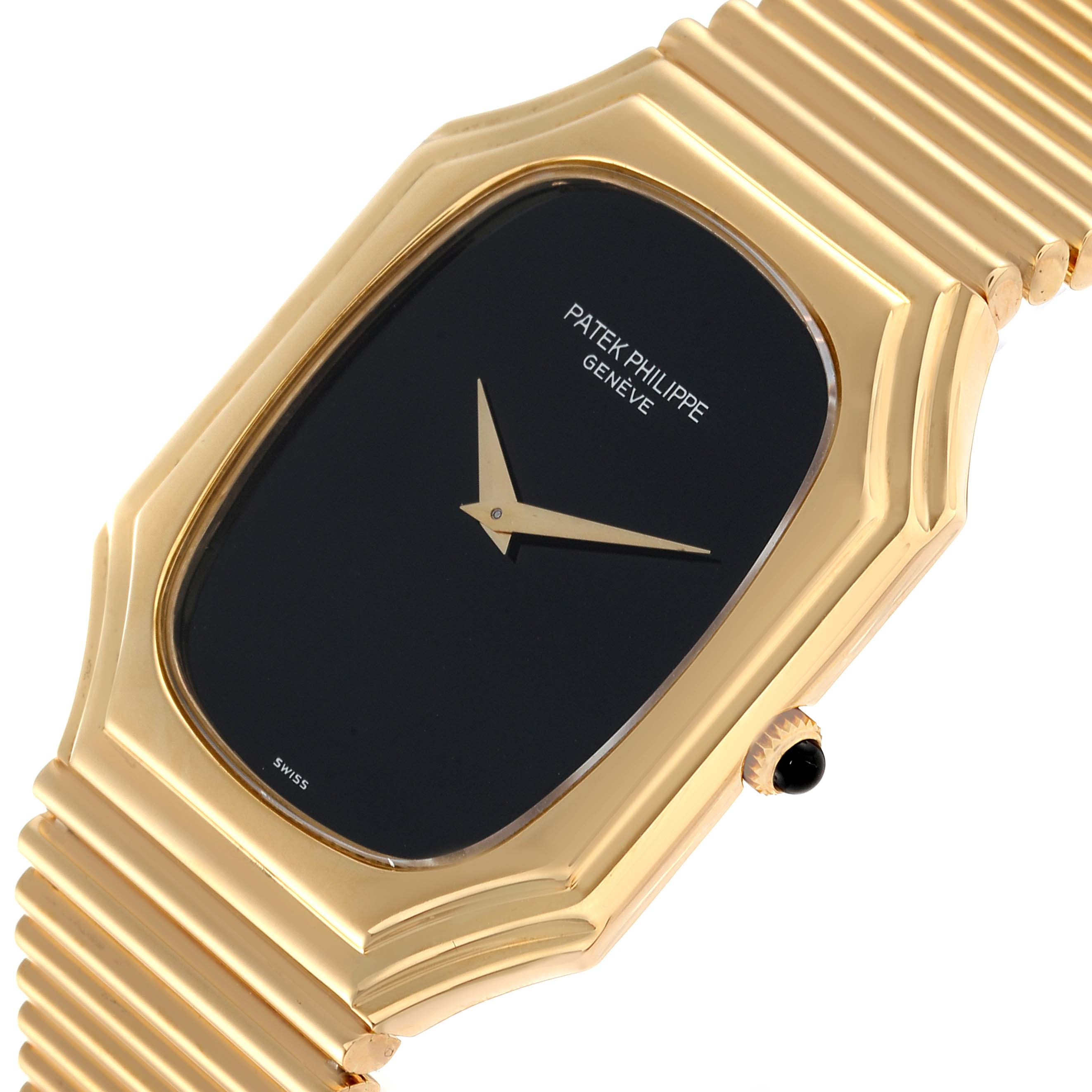 This image shows a close-up, angled view of the face and part of the band of a Vintage Patek Philippe watch.