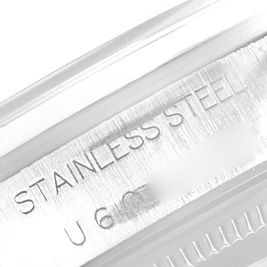 This close-up image shows the side view of the Rolex Air-King 14000 Men's Stainless Steel Blue Dial 14000 Men's Stainless Steel Blue Dial watch, highlighting the "Stainless Steel" engraving.