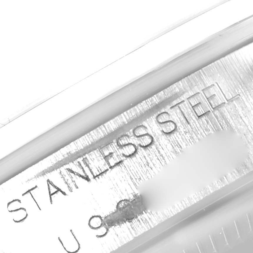 This image shows a close-up of the stainless steel engraving along with part of the serial number inside a Rolex Air-King 14000 Men's Stainless Steel Blue Dial 14000 Men's Stainless Steel Blue Dial watch.