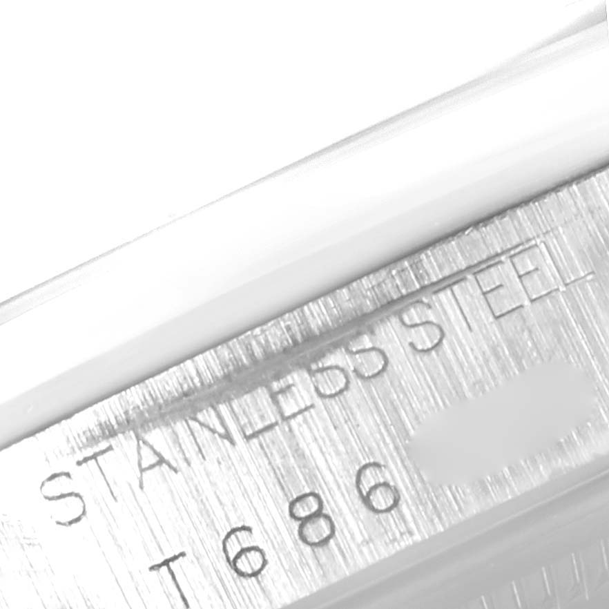 The image shows a close-up of the stainless steel casing with engraved text and serial number of a Rolex Air-King 14000 Men's Stainless Steel Blue Dial 14000 Men's Stainless Steel Blue Dial watch.