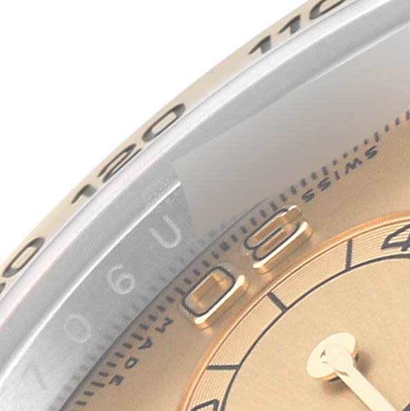 This close-up image shows part of the bezel and the dial of a Rolex Daytona 116503 Men's Steel and Gold (two tone) Champagne Dial 116503 Men's Steel and Gold (two tone) Champagne Dial watch.