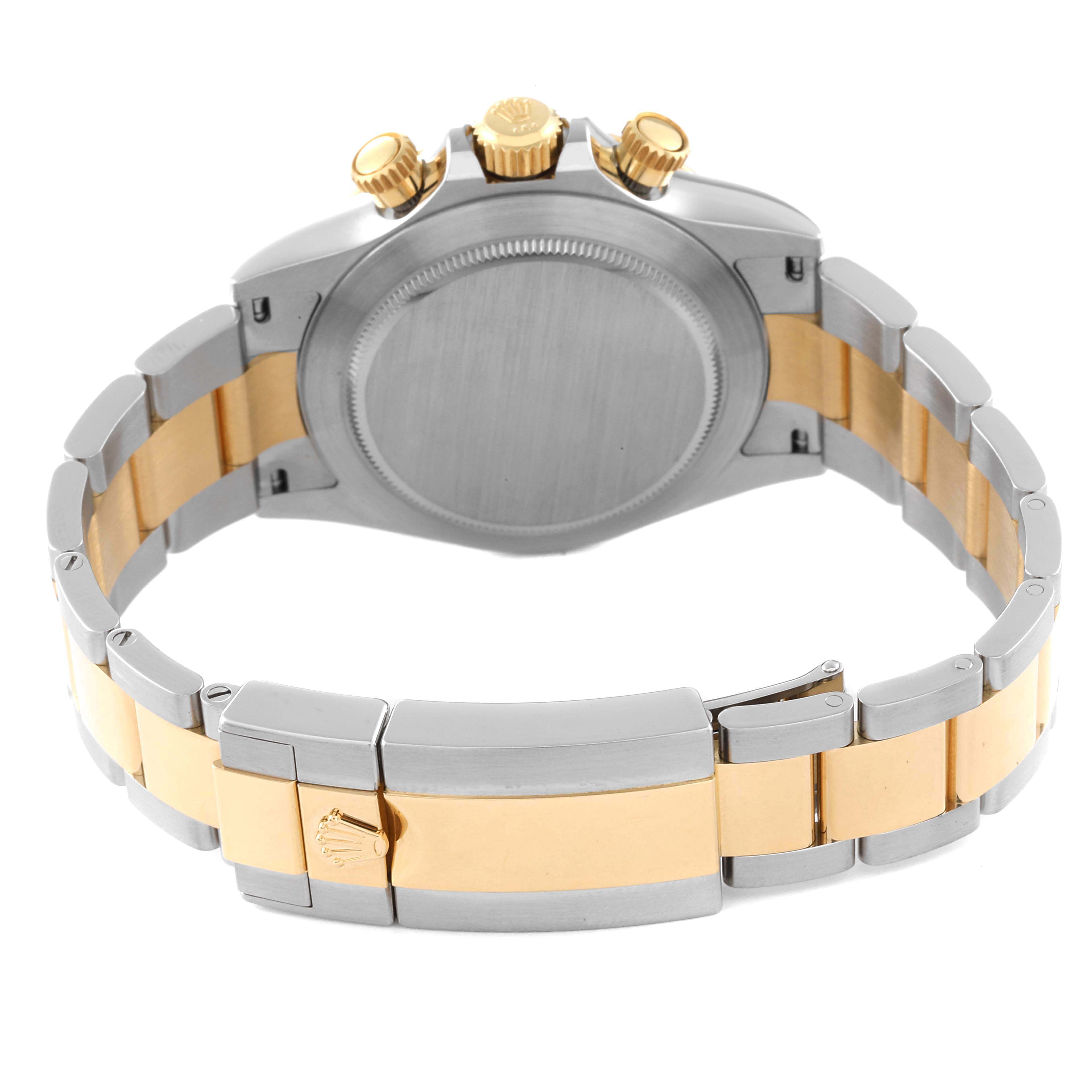 This image shows the back view of a Rolex Daytona 116503 Men's Steel and Gold (two tone) Champagne Dial 116503 Men's Steel and Gold (two tone) Champagne Dial watch, highlighting the clasp, bracelet, and chronograph buttons.