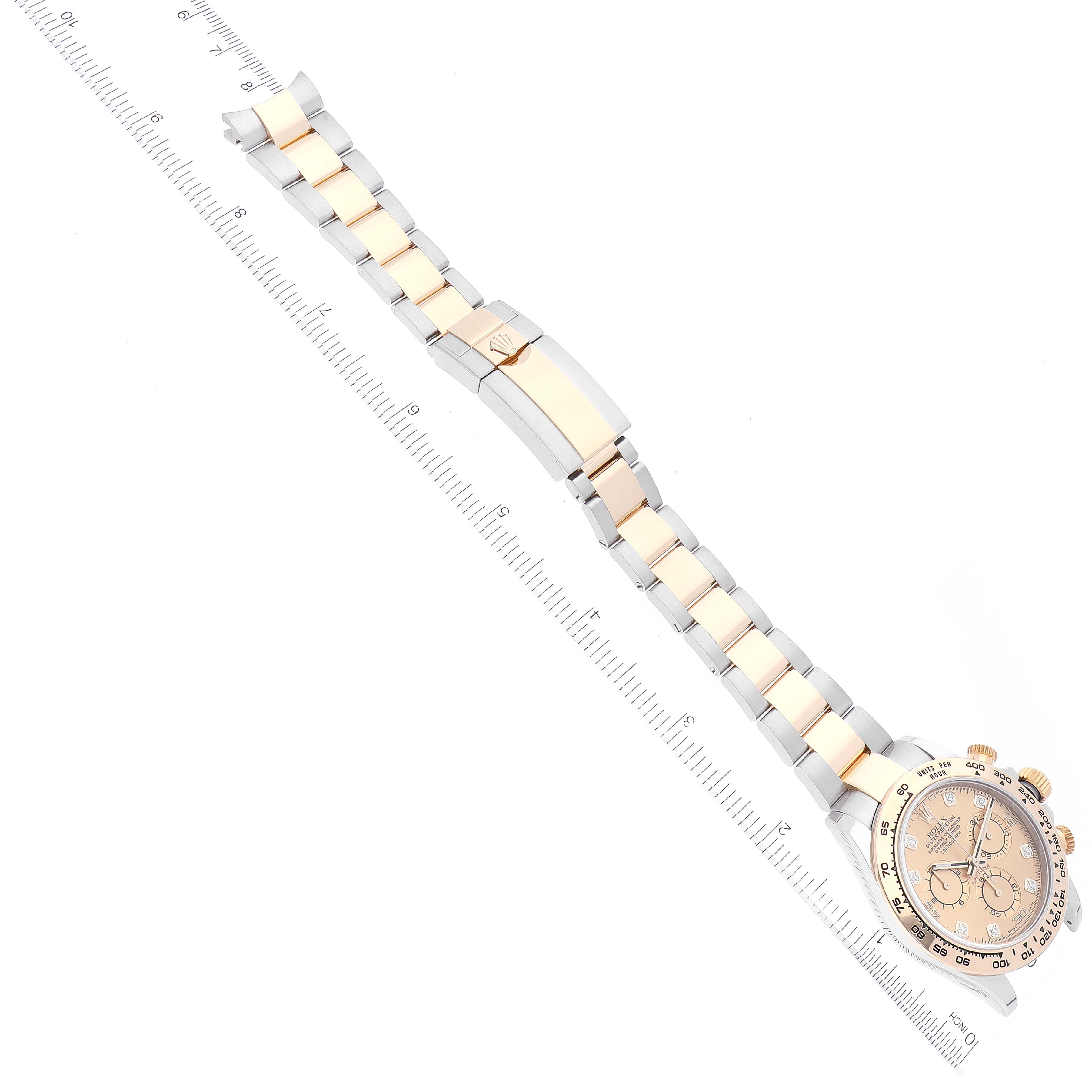 The image shows a Rolex Daytona 116503 Men's Steel and Gold (two tone) Champagne Dial 116503 Men's Steel and Gold (two tone) Champagne Dial watch laid flat, with the full bracelet and clasp visible, alongside a measuring ruler.