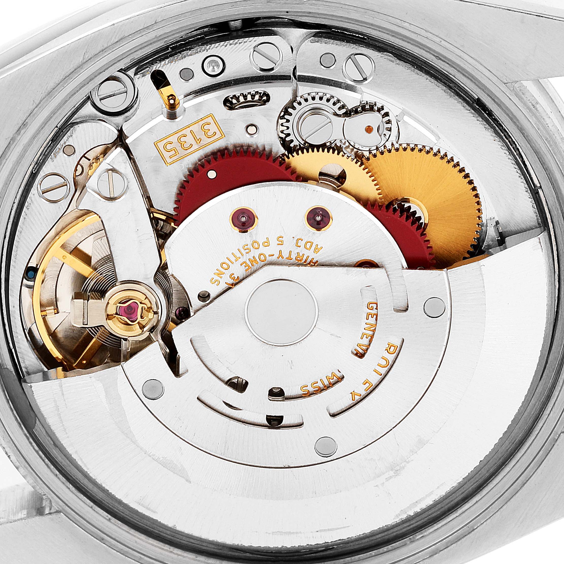 Close-up shot showing the movement and inner mechanisms of a Rolex Date 115200 Men's Stainless Steel Black Dial 115200 Men's Stainless Steel Black Dial model watch with visible gears and components.