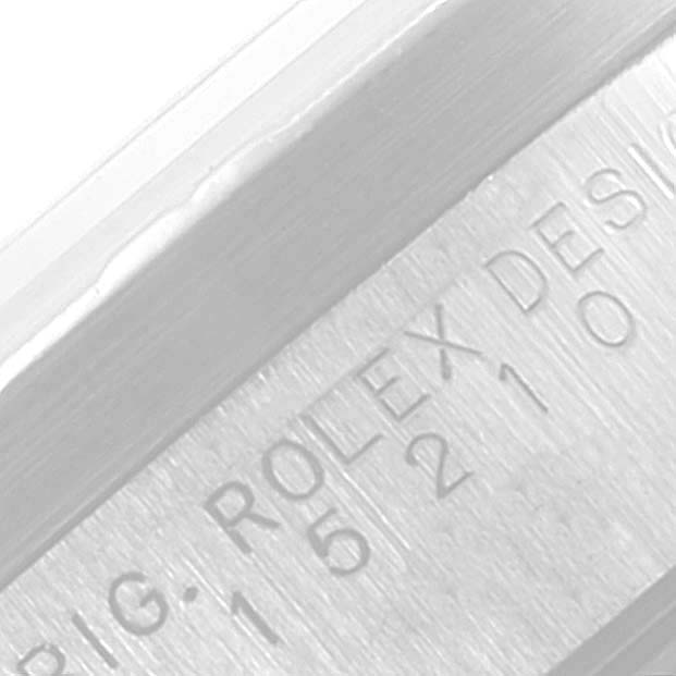 The image shows a close-up view of the engraving on the bezel of a Rolex Date 15210 Men's Stainless Steel Pink Dial 15210 Men's Stainless Steel Pink Dial watch.
