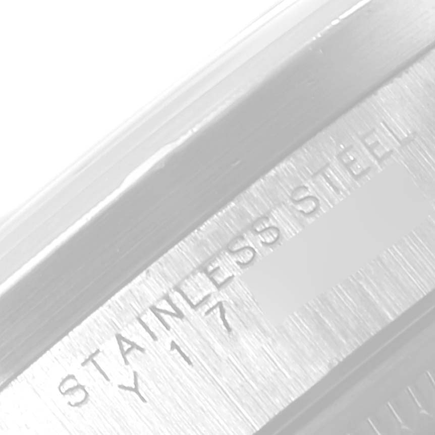 This close-up angle of the Rolex Date 15210 Men's Stainless Steel Pink Dial 15210 Men's Stainless Steel Pink Dial model showcases the "STAINLESS STEEL" engraving on the watch case.