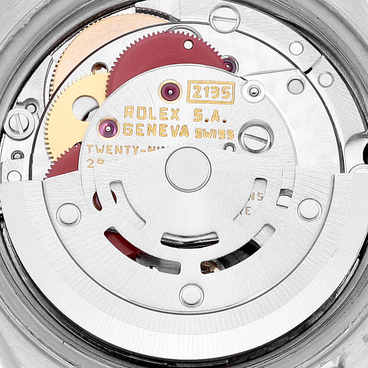 This image shows a close-up of the Rolex Datejust 69173 Women's Steel and Gold (two tone) Black Dial 69173 Women's Steel and Gold (two tone) Black Dial watch movement, model 2135, highlighting its internal gears and components.