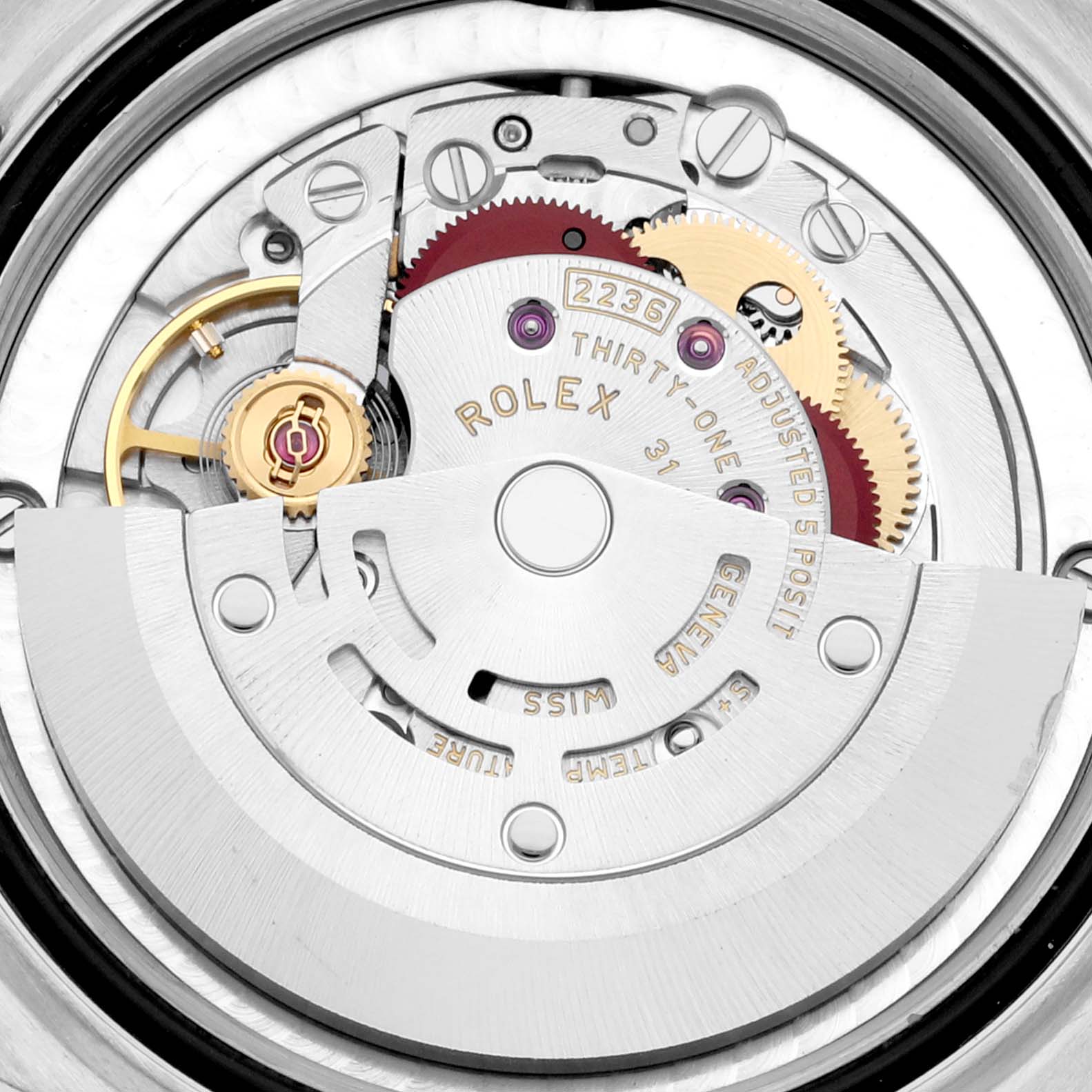 This image shows the internal mechanism of a Mid-Size Rolex watch from a close-up, top-down angle.