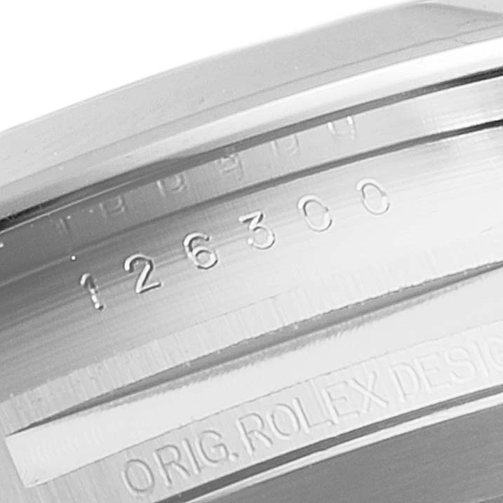 This image shows the serial number and part of the caseback for the Rolex Datejust 41 126300 Men's Stainless Steel Blue Dial 126300 Men's Stainless Steel Blue Dial watch.