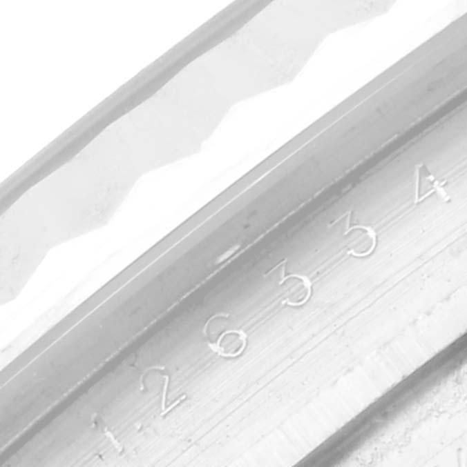 The image shows a close-up of the Rolex Datejust 41 126334NG Men
s Stainless Steel Mother of Pearl Dial 126334NG Men
s Stainless Steel Mother of Pearl Dial model
s bezel and serial numbers.