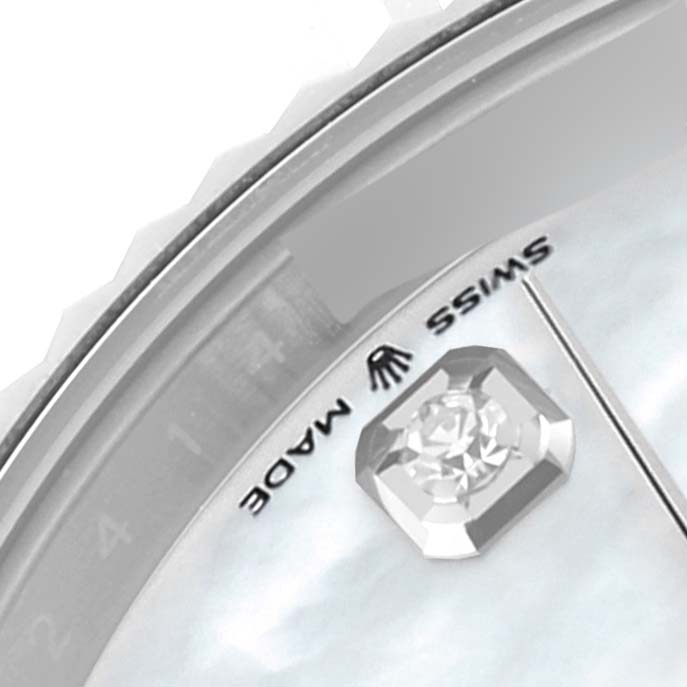 This close-up image shows a partial view of the dial and crystal of the Rolex Datejust 41 126334NG Men
s Stainless Steel Mother of Pearl Dial 126334NG Men
s Stainless Steel Mother of Pearl Dial watch, highlighting the "SWISS MADE" inscription and a diamond marker.