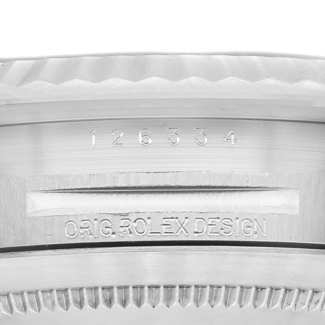 Close-up of the side of a Rolex Datejust 41 126334 Men's Stainless Steel Grey Dial 126334 Men's Stainless Steel Grey Dial case, showing the model number and "ORIG. ROLEX DESIGN" engraving.
