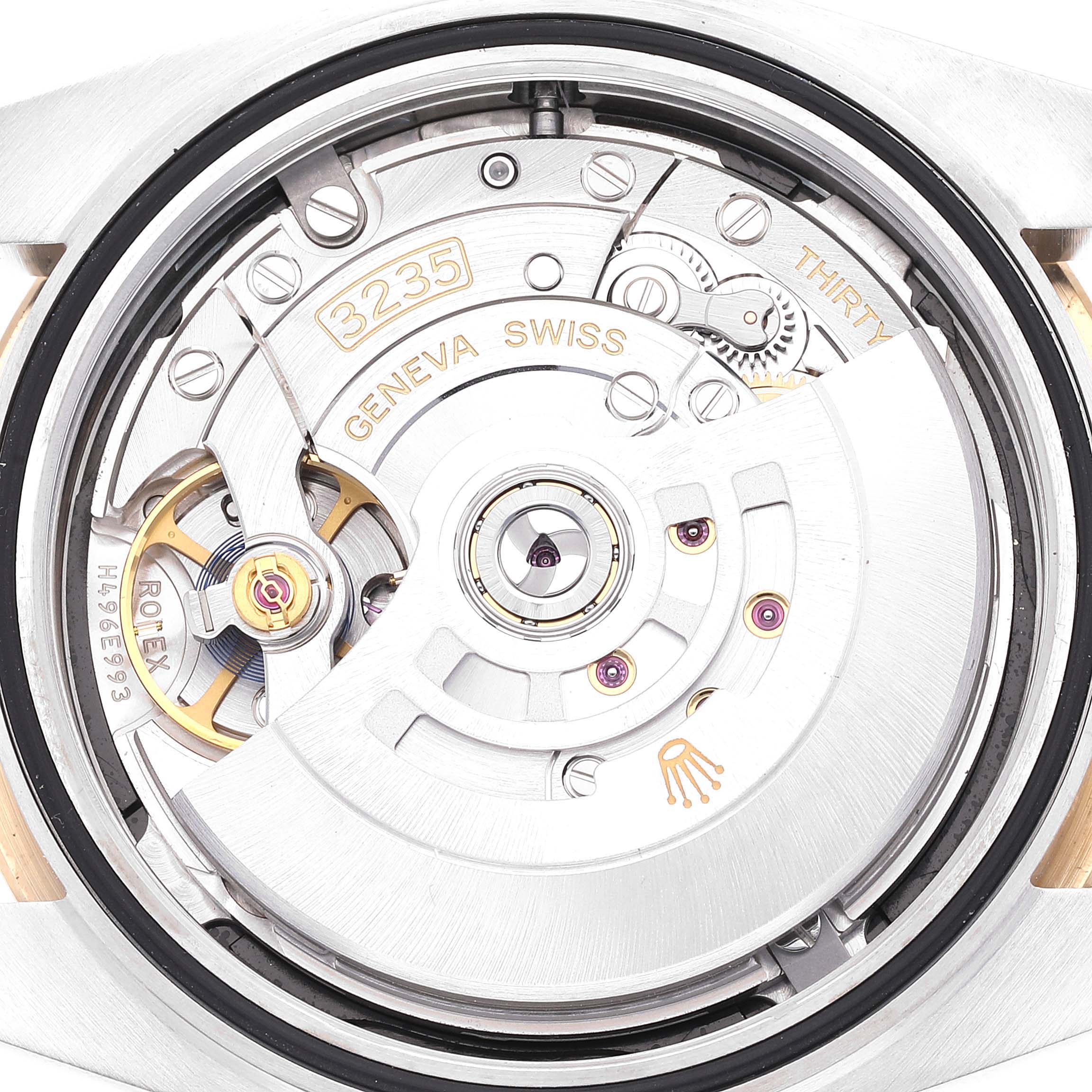 The image shows a close-up view of the movement and inner workings of a Rolex Datejust 41 126333 Men's Steel and Gold (two tone) Black Dial 126333 Men's Steel and Gold (two tone) Black Dial watch.