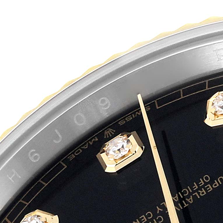 The image shows a close-up of the dial and bezel of the Rolex Datejust 41 126333 Men's Steel and Gold (two tone) Black Dial 126333 Men's Steel and Gold (two tone) Black Dial, highlighting the diamond markers.