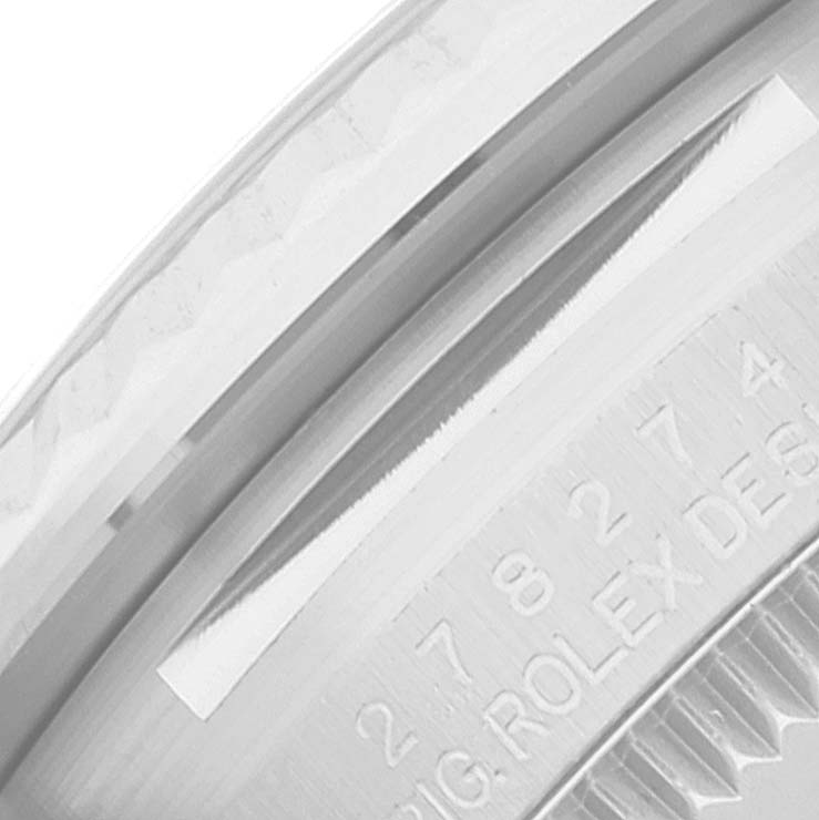 The image shows a close-up of the watch case back and engraving of a Mid-Size Rolex model.