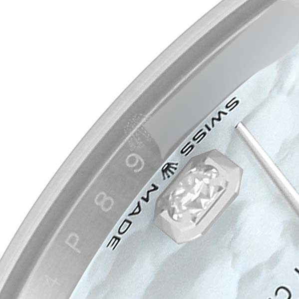 The close-up angle shows part of the dial and indices of a Mid-Size Rolex watch.