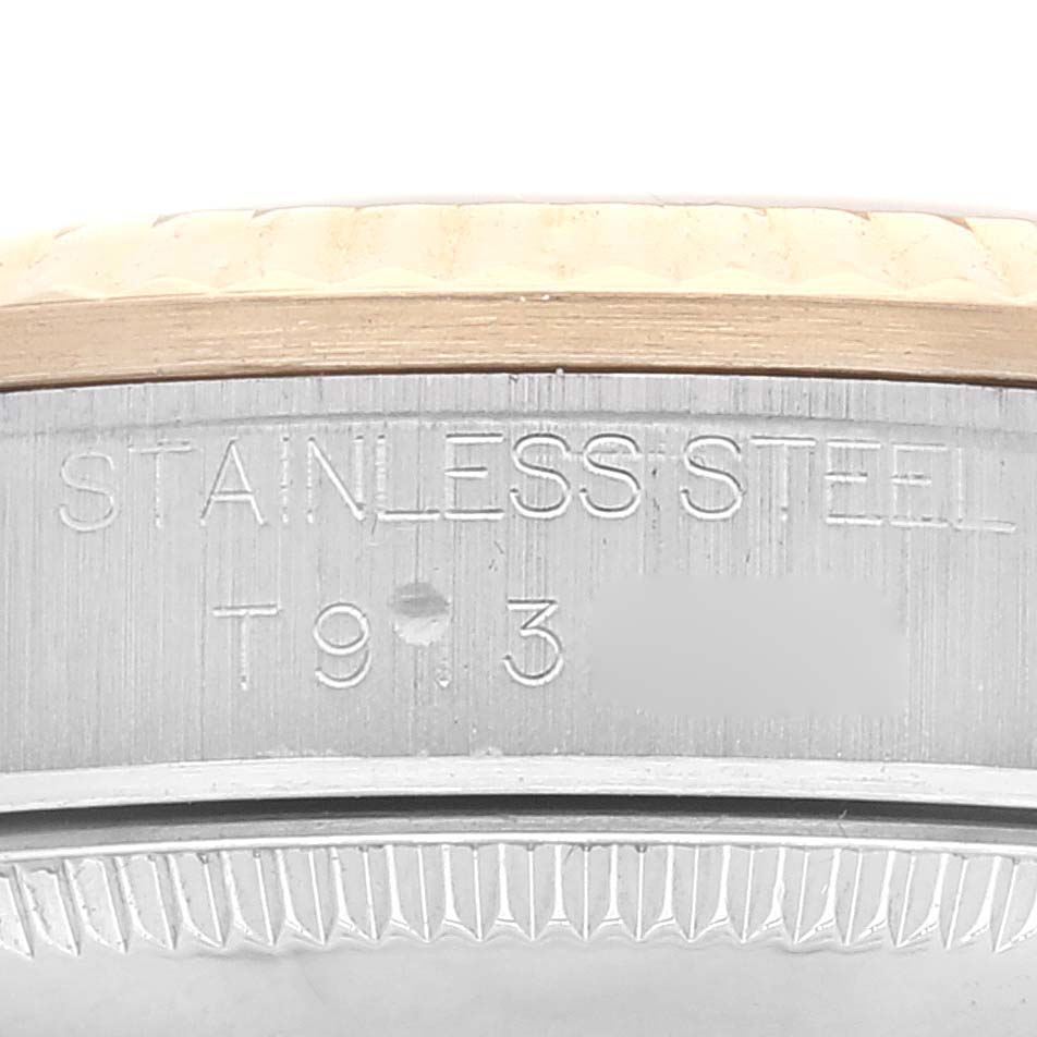 The image shows a close-up of the side engraving on the stainless steel case of a Rolex Mid-Size 68273 Women
s Steel and Gold (two tone) Champagne Dial 68273 Women
s Steel and Gold (two tone) Champagne Dial model watch.