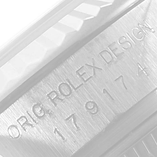 The image shows a close-up angle of the engraved side of a Rolex Datejust 179174 Women's Stainless Steel Pink Dial 179174 Women's Stainless Steel Pink Dial watch.