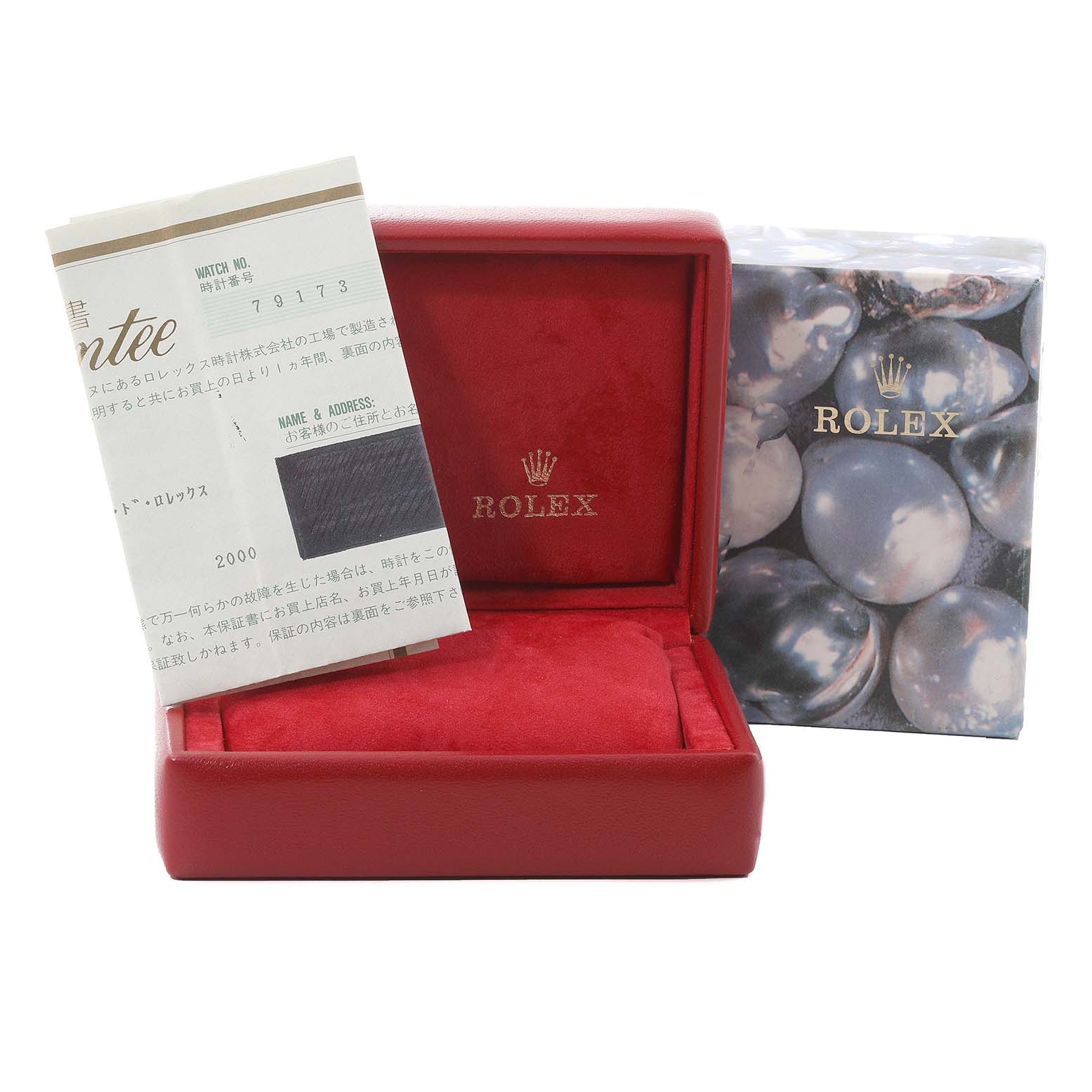 This image shows the accessories for a Rolex Datejust 79173 Women's Steel and Gold (two tone) Champagne Dial 79173 Women's Steel and Gold (two tone) Champagne Dial, including a red watch case, warranty card, and an outer box with a pearl design.