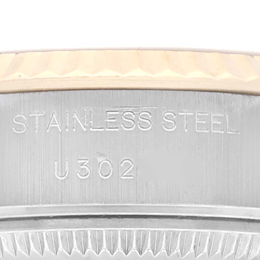 The image shows a close-up view of the side of a Rolex Datejust 69173 Women's Steel and Gold (two tone) Mother of Pearl Dial 69173 Women's Steel and Gold (two tone) Mother of Pearl Dial watch, highlighting the "Stainless Steel" engraving.