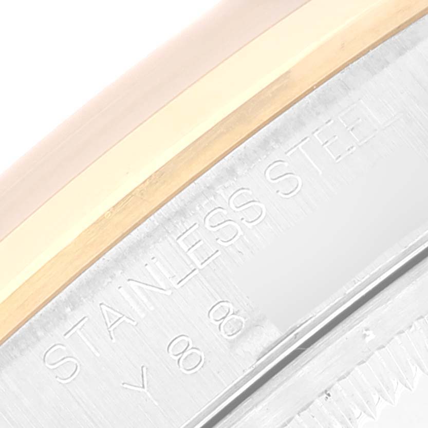 The image shows a close-up of the side of a Rolex Datejust 16203 Men's Steel and Gold (two tone) Grey Dial 16203 Men's Steel and Gold (two tone) Grey Dial watch with visible text "STAINLESS STEEL" engraved on the case.