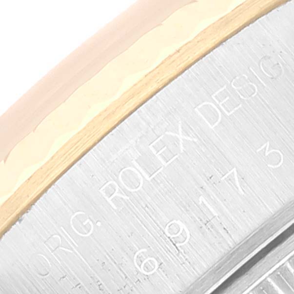 This is a close-up of the engraved side of the case of a Rolex Datejust 69173 Women's Stainless Steel White Dial 69173 Women's Stainless Steel White Dial watch, showing part of its serial number.