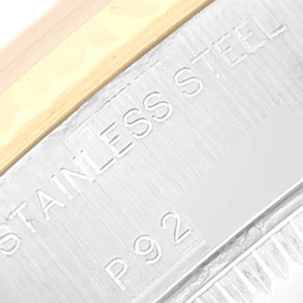 This image shows a close-up of the case and bracelet of a Rolex Datejust 79173 Women's Steel and Gold (two tone) White Dial 79173 Women's Steel and Gold (two tone) White Dial watch, highlighting the "STAINLESS STEEL" engraving.
