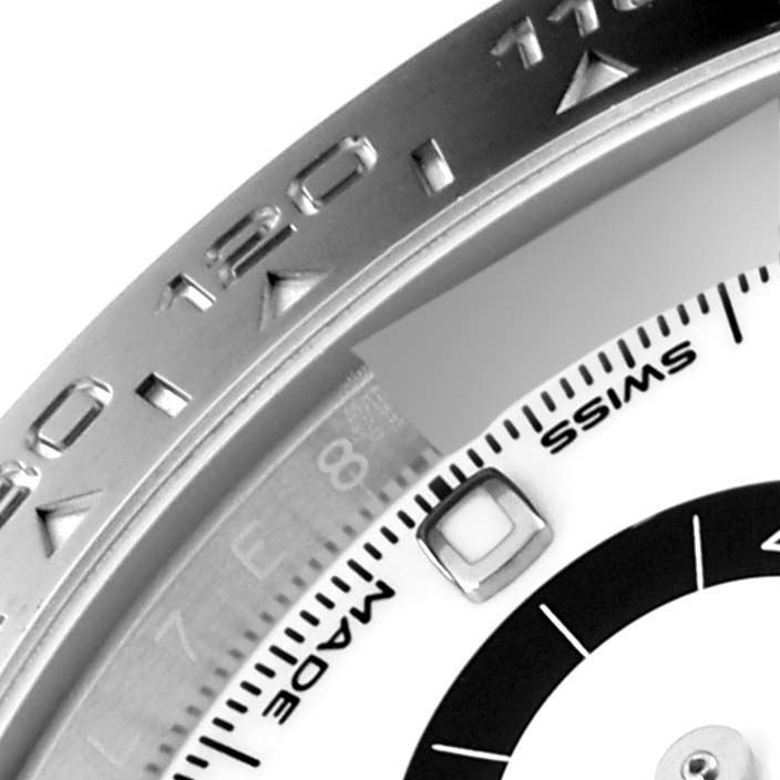 Close-up of the Rolex Daytona 116500 Men's Stainless Steel White Dial 116500 Men's Stainless Steel White Dial watch, showing part of the bezel and a portion of the dial with "SWISS MADE" text.