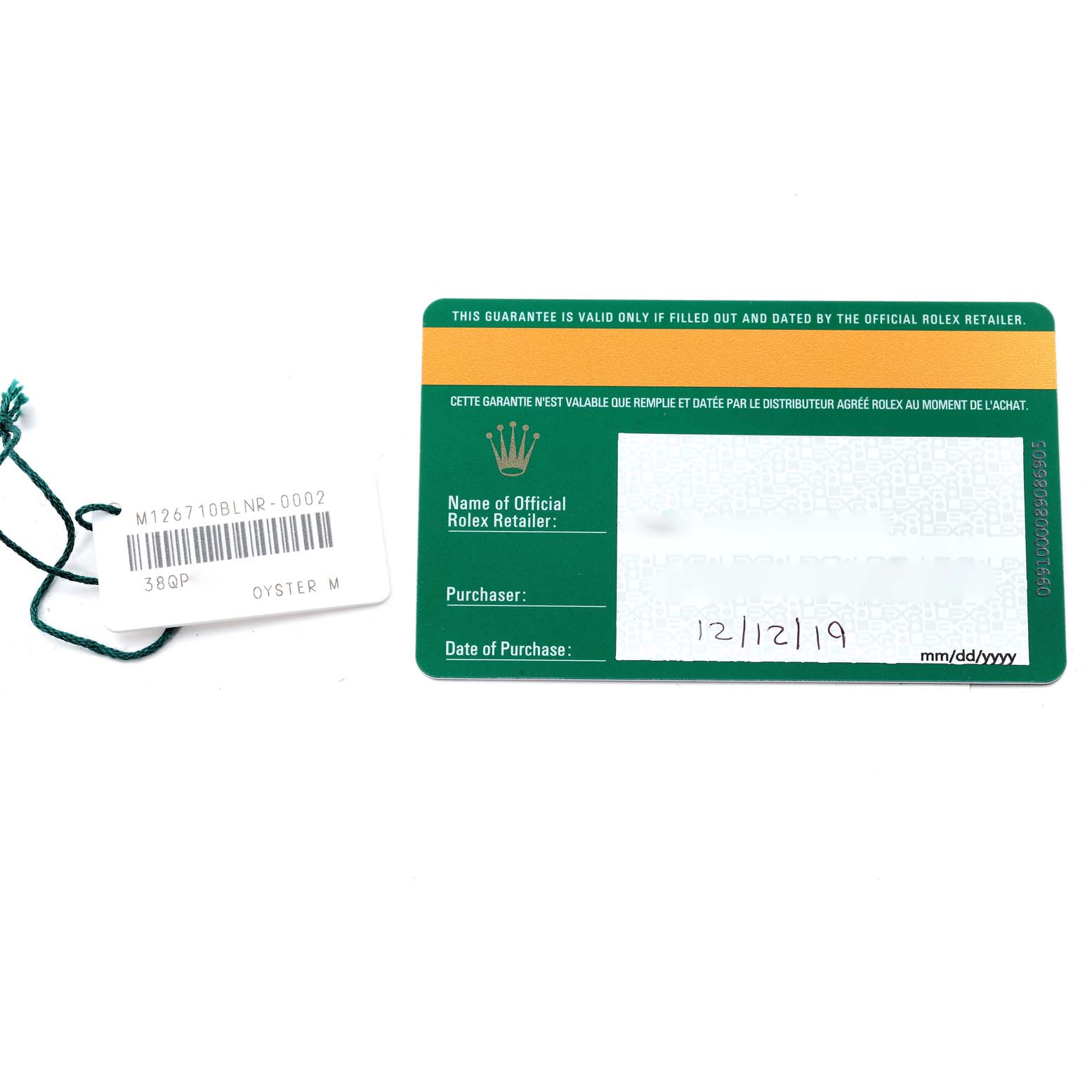 The image shows the warranty card and tag for a Rolex GMT-Master 126710 Men
s Stainless Steel Black Dial 126710 Men
s Stainless Steel Black Dial watch, with the tag displaying the model number "M126710BLNR-0002."