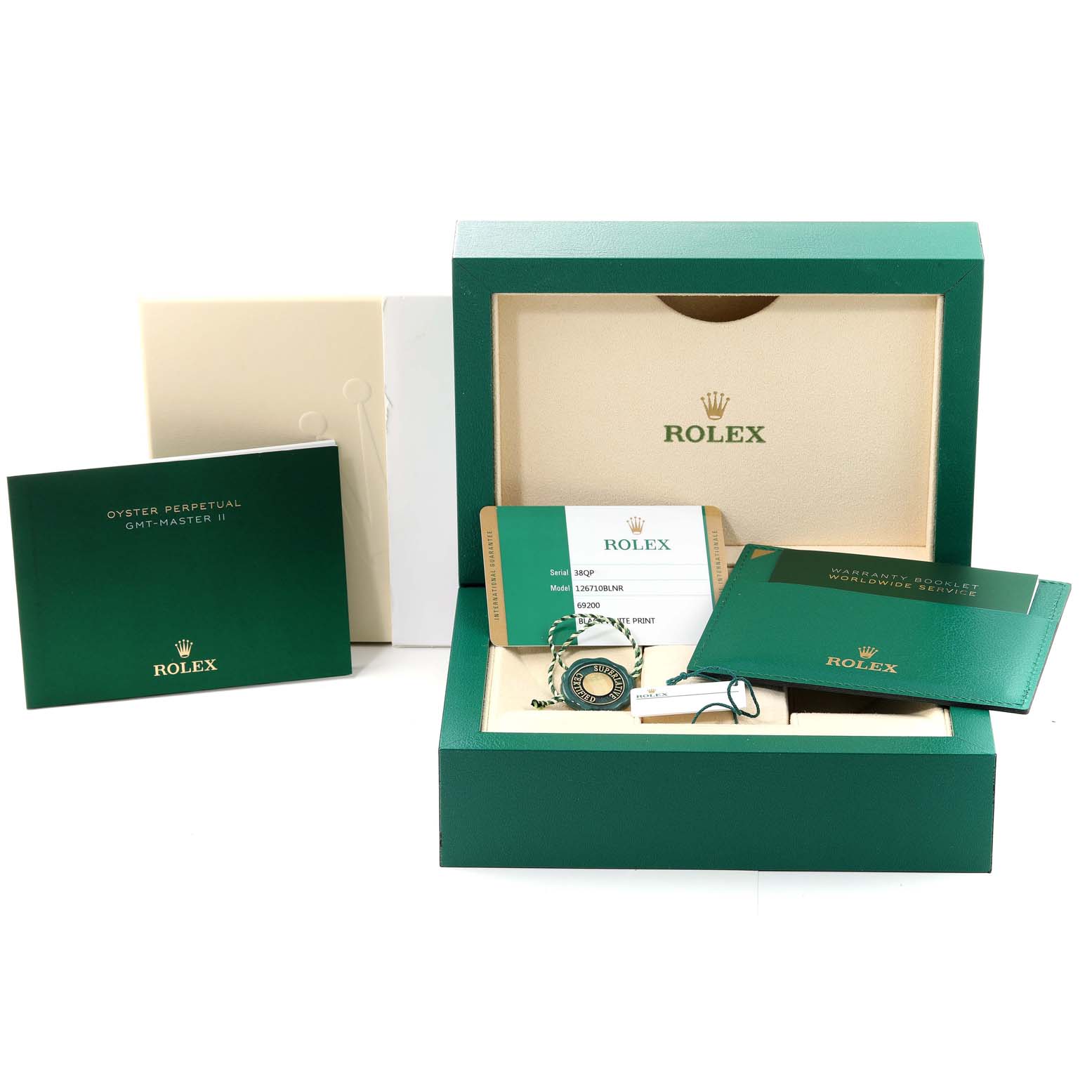 This image displays the packaging, warranty card, and booklets for a Rolex GMT-Master 126710 Men
s Stainless Steel Black Dial 126710 Men
s Stainless Steel Black Dial watch.