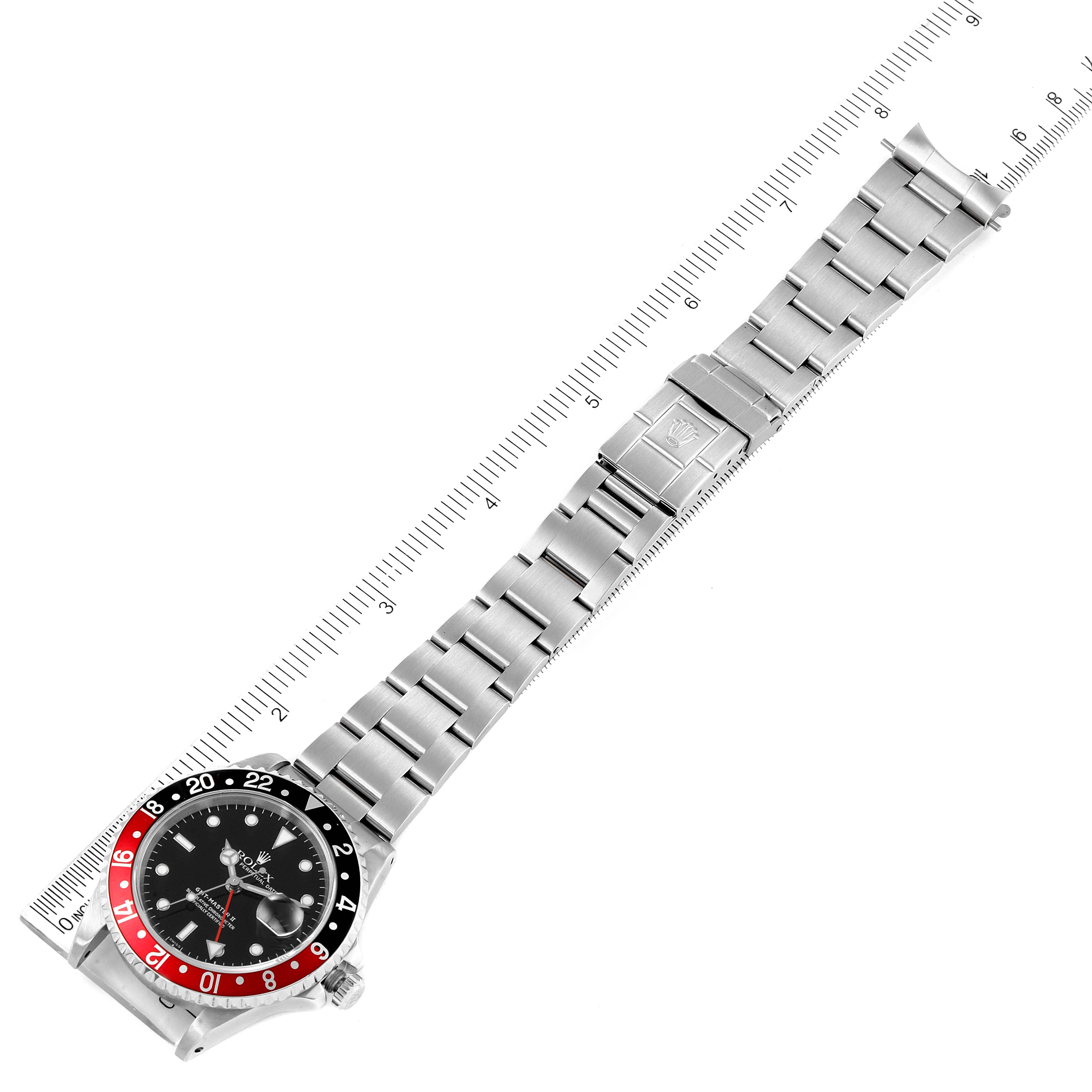 The image shows a Rolex GMT-Master 16710 Men's Stainless Steel Black Dial 16710 Men's Stainless Steel Black Dial watch laid flat with its entire bracelet and clasp visible, measured alongside a ruler.