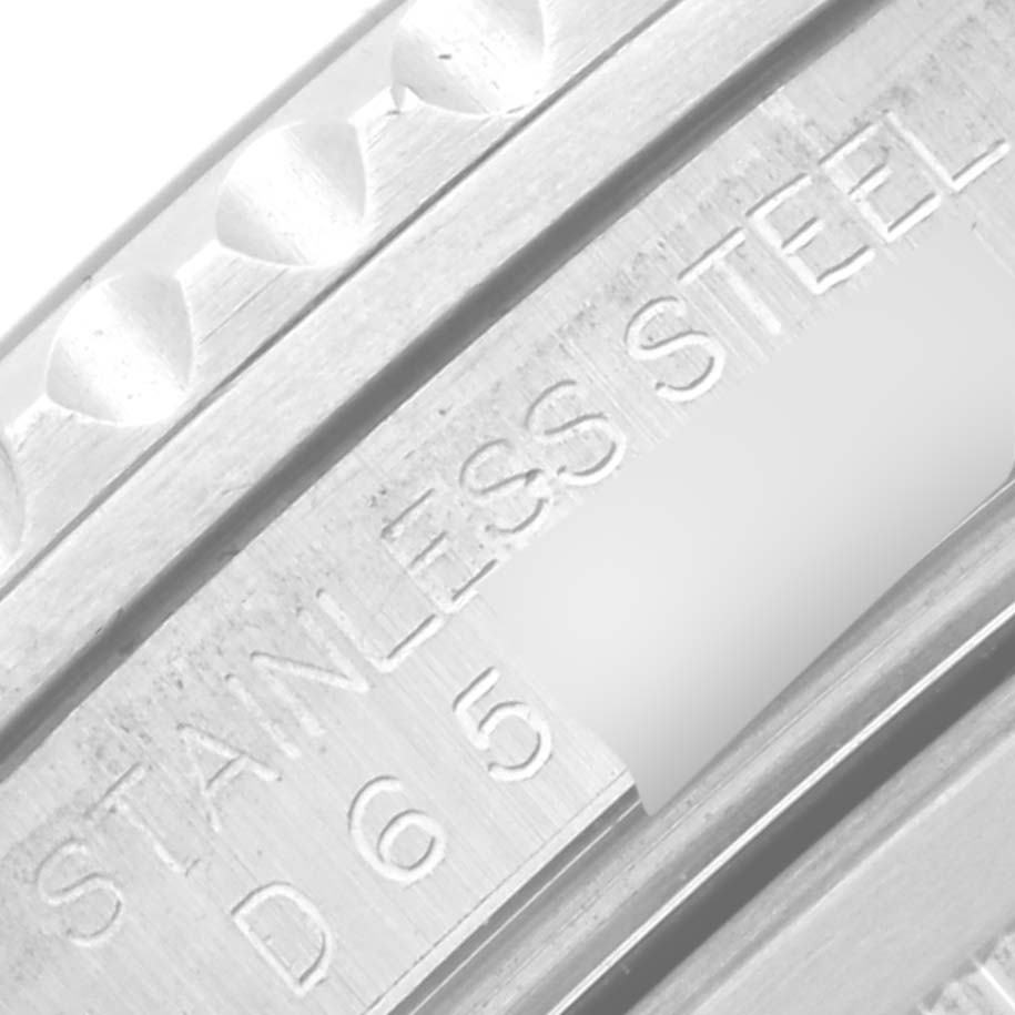 The image shows an angled close-up of the stainless steel part of a Rolex GMT-Master 16710 Men's Stainless Steel Black Dial 16710 Men's Stainless Steel Black Dial watch, including the engraved serial number.