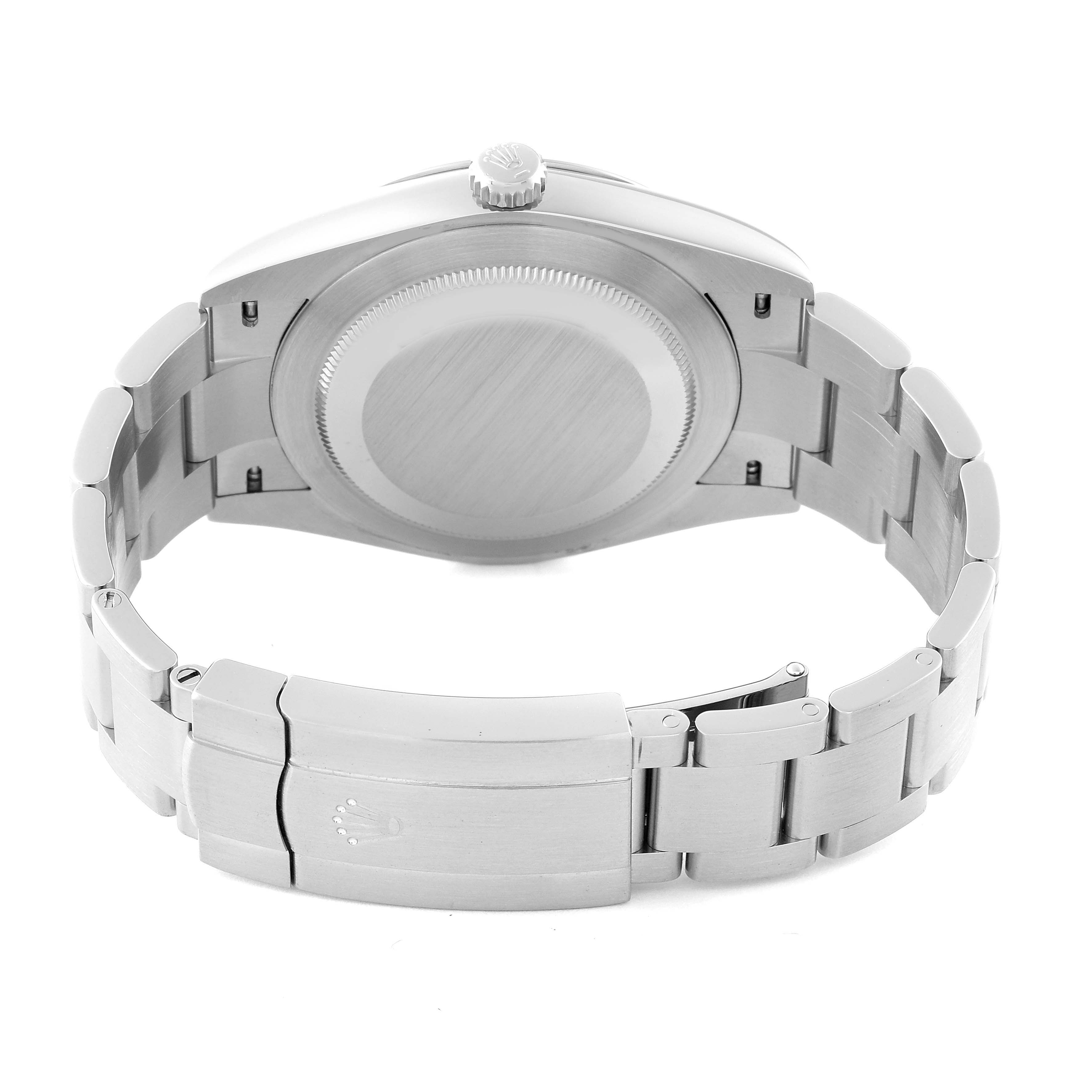 The image shows the back case and clasp of a Rolex Oyster Perpetual 124300 Men
s Stainless Steel Blue Dial 124300 Men
s Stainless Steel Blue Dial watch from a rear angle.