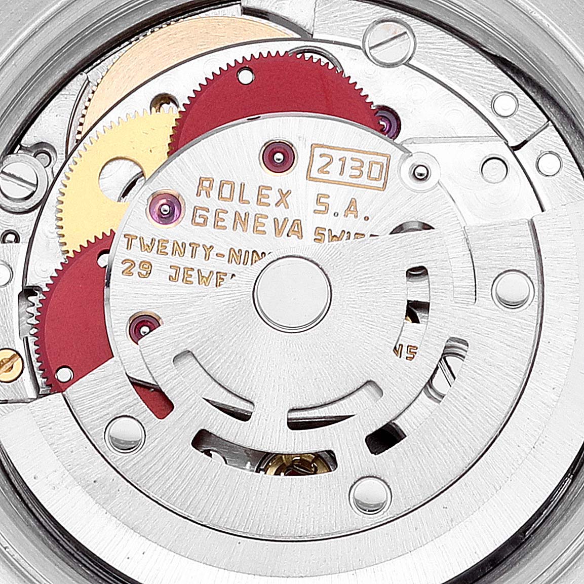 This image shows the intricate internal mechanical movement of the Rolex Oyster Perpetual 67193 Women's Steel and Gold (two tone) Blue Dial 67193 Women's Steel and Gold (two tone) Blue Dial watch from a close-up angle.