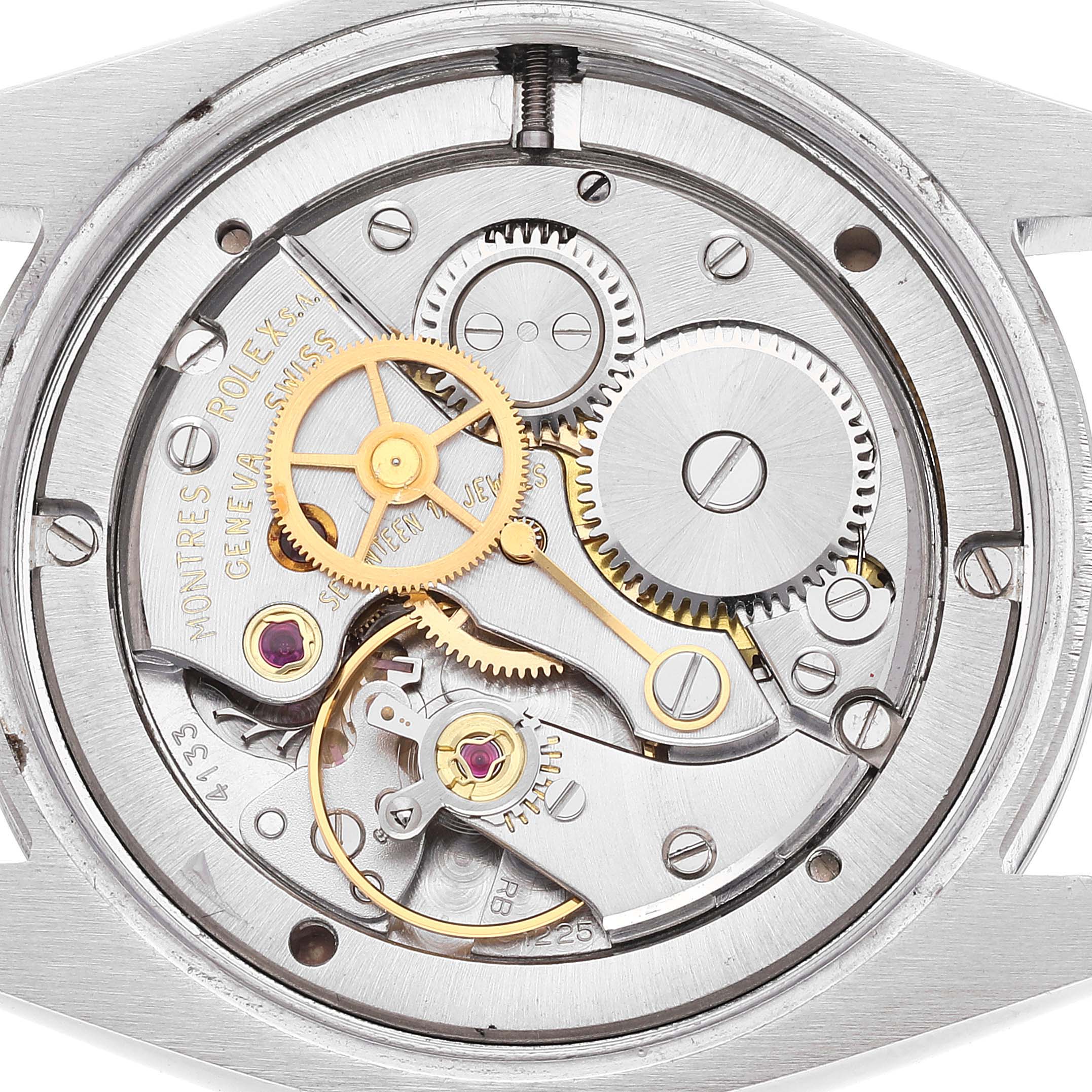 This image shows an inside view of the watch movement from a Vintage Collection model by Rolex, displaying gears and mechanical components.