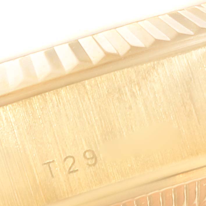 The image shows a close-up of the edge and bezel of a Rolex President 69178 Women
s Yellow Gold Champagne Dial 69178 Women
s Yellow Gold Champagne Dial model watch.