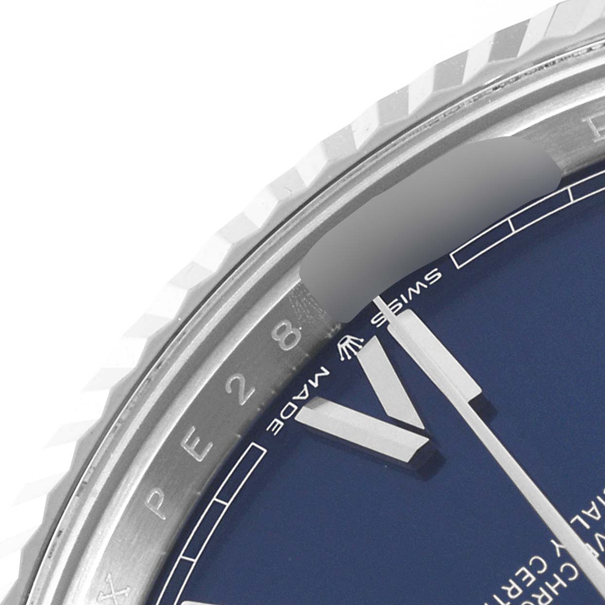 The image shows the upper left section of a Rolex President 228239 Men's White Gold Blue Dial 228239 Men's White Gold Blue Dial watch, including part of the dial and fluted bezel.